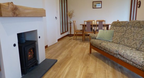 Barr-beithe Lower Lounge and Dining Area chairs, gas stove and dining table
