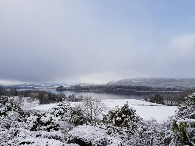 snow covered fields and a scottish loch