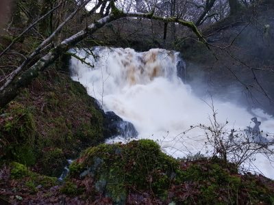 small waterfall in full flood